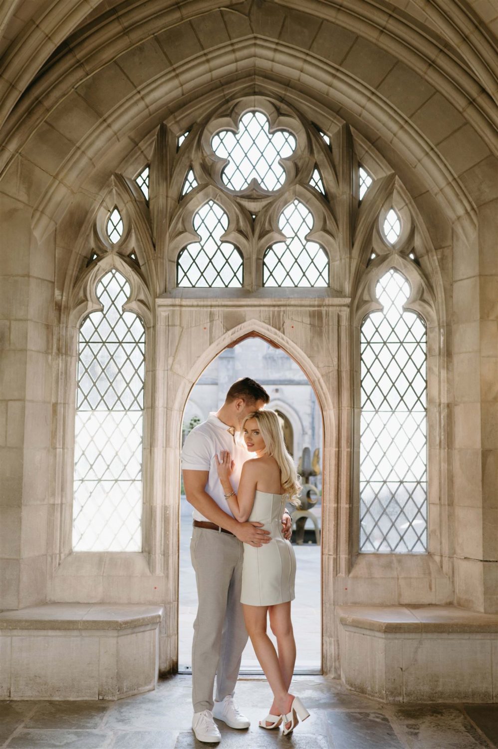 national cathedral engagement photos couple archway