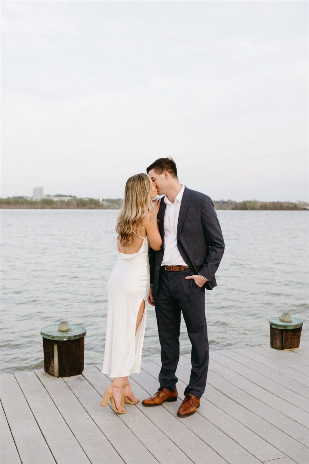 waterfront engagement couple kissing