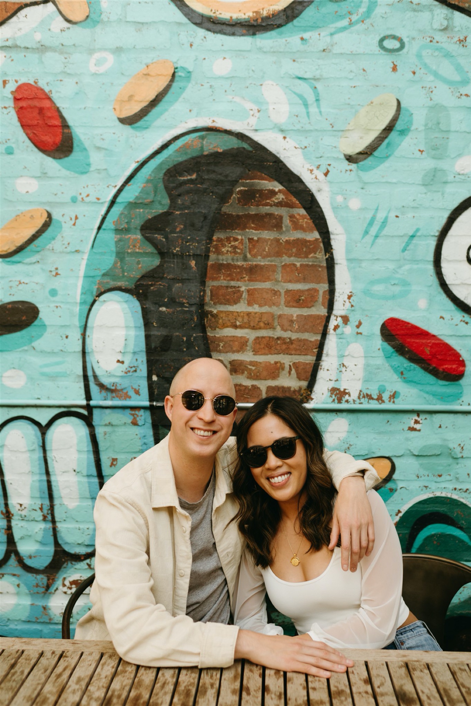 h street engagement session couple hugging sunglasses