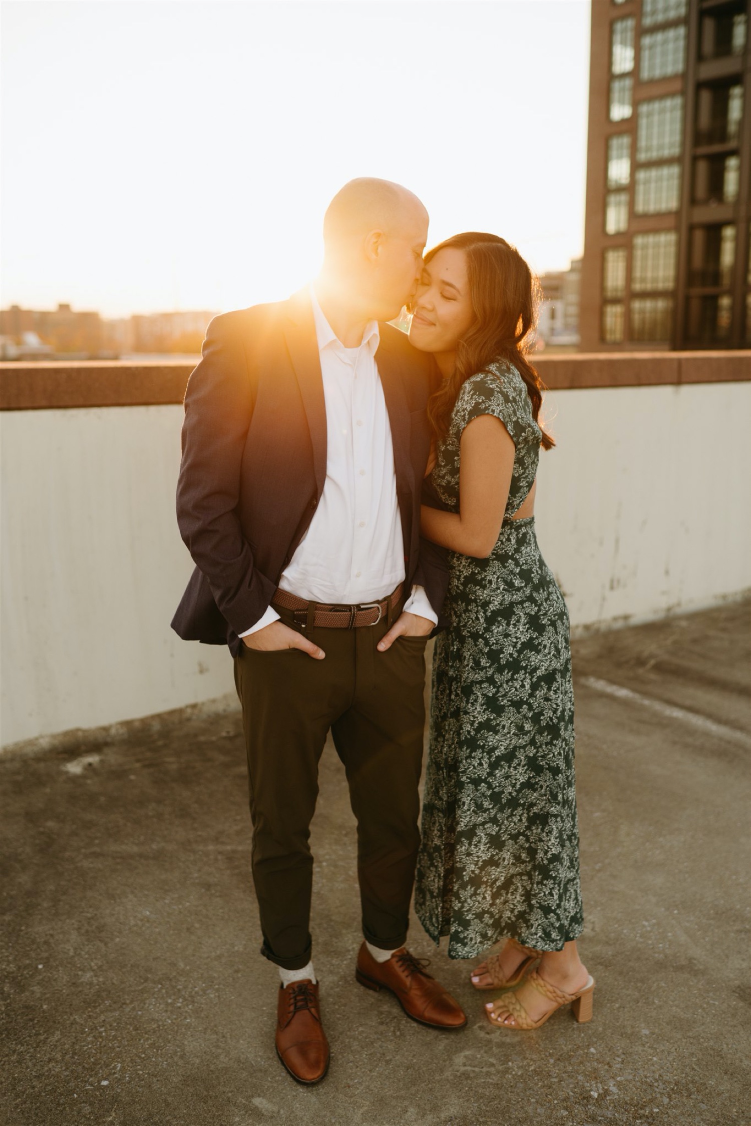 h street engagement session man kissing woman golden hour