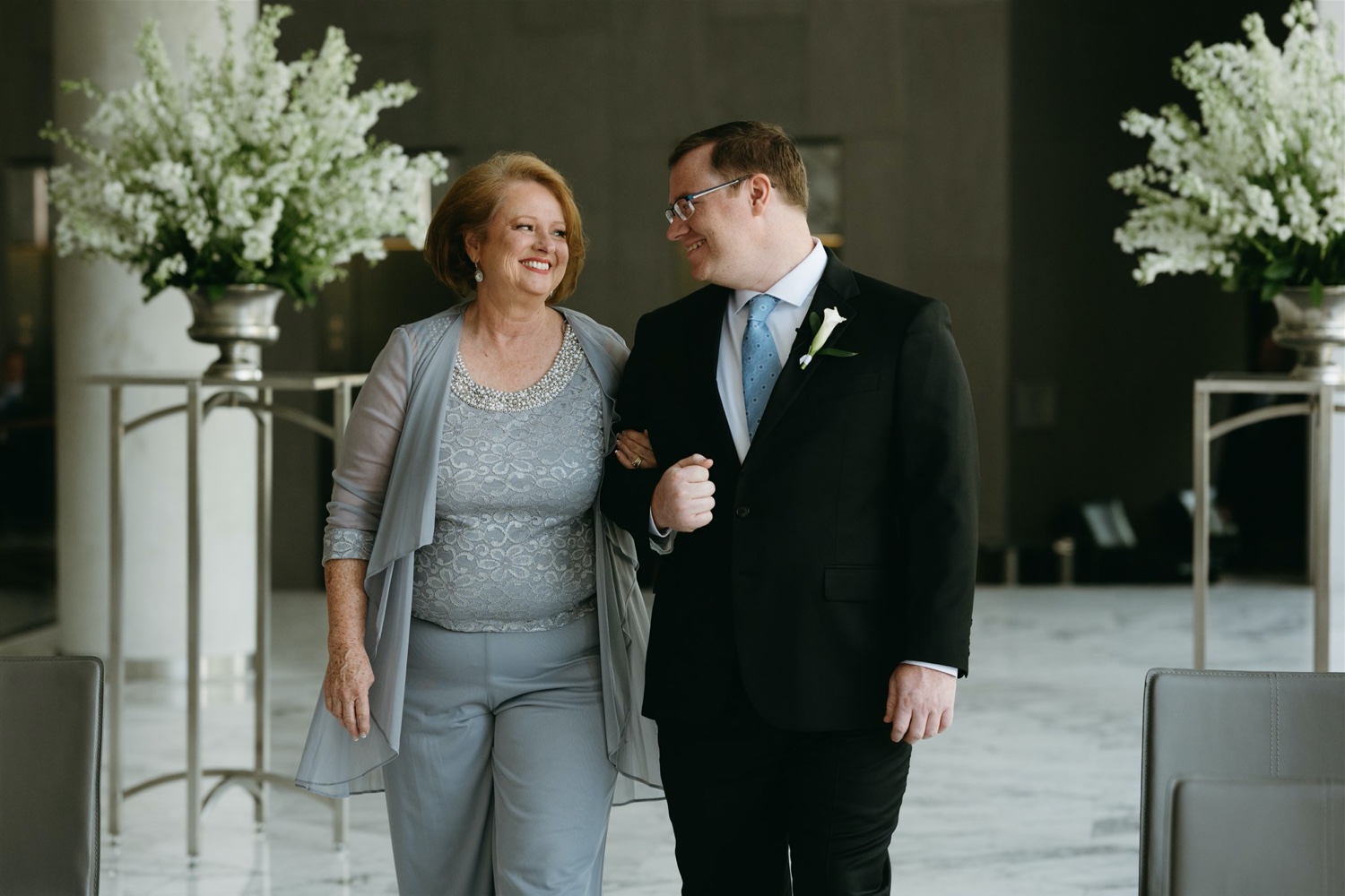 groom and mother of the groom smiling ceremony aisle intimate wedding the jefferson hotel