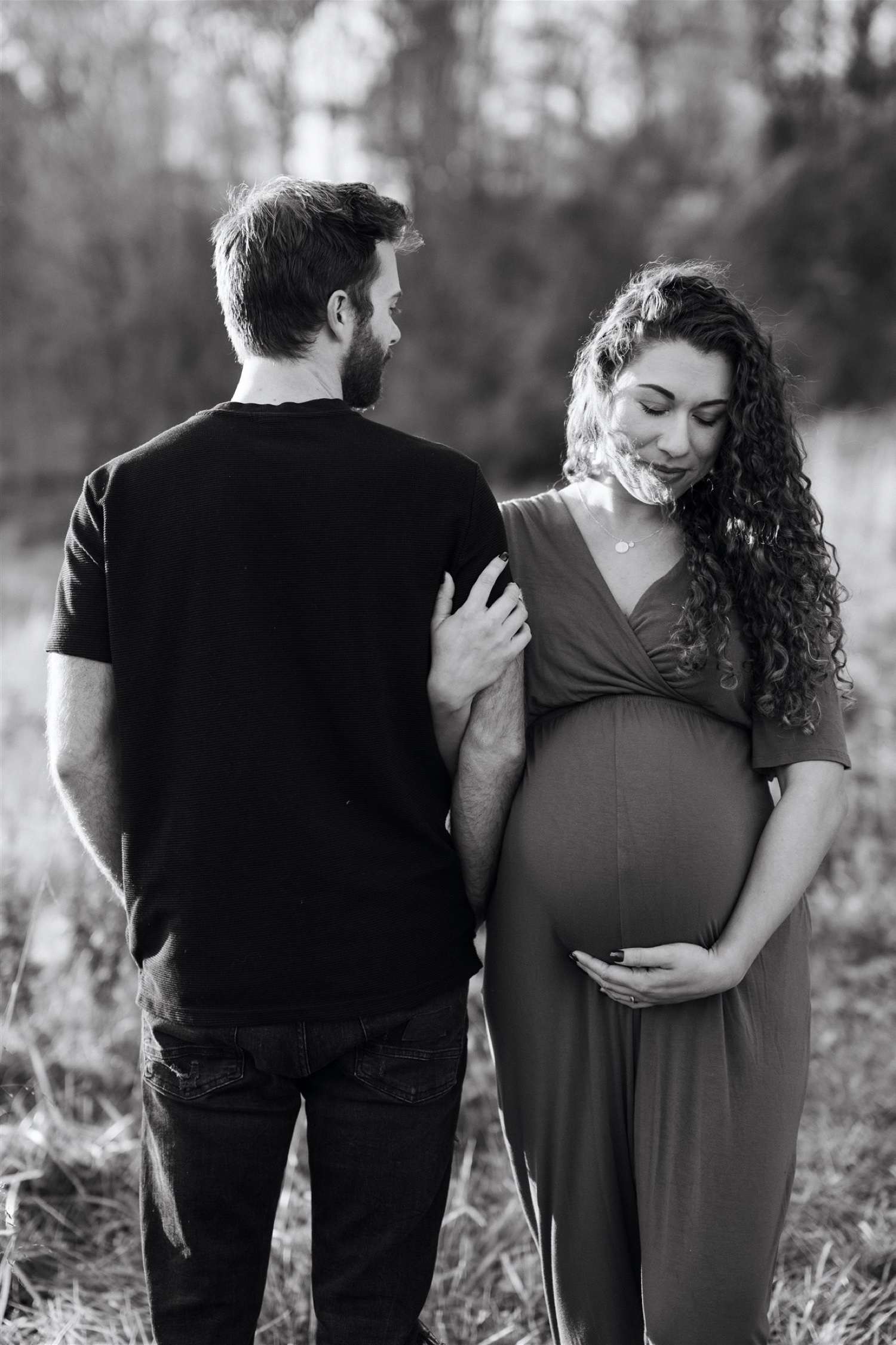 black and white husband and wife maternity pose