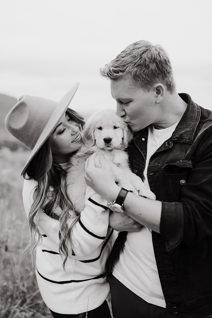 engagement photos with your dog black and white couple hugging dog