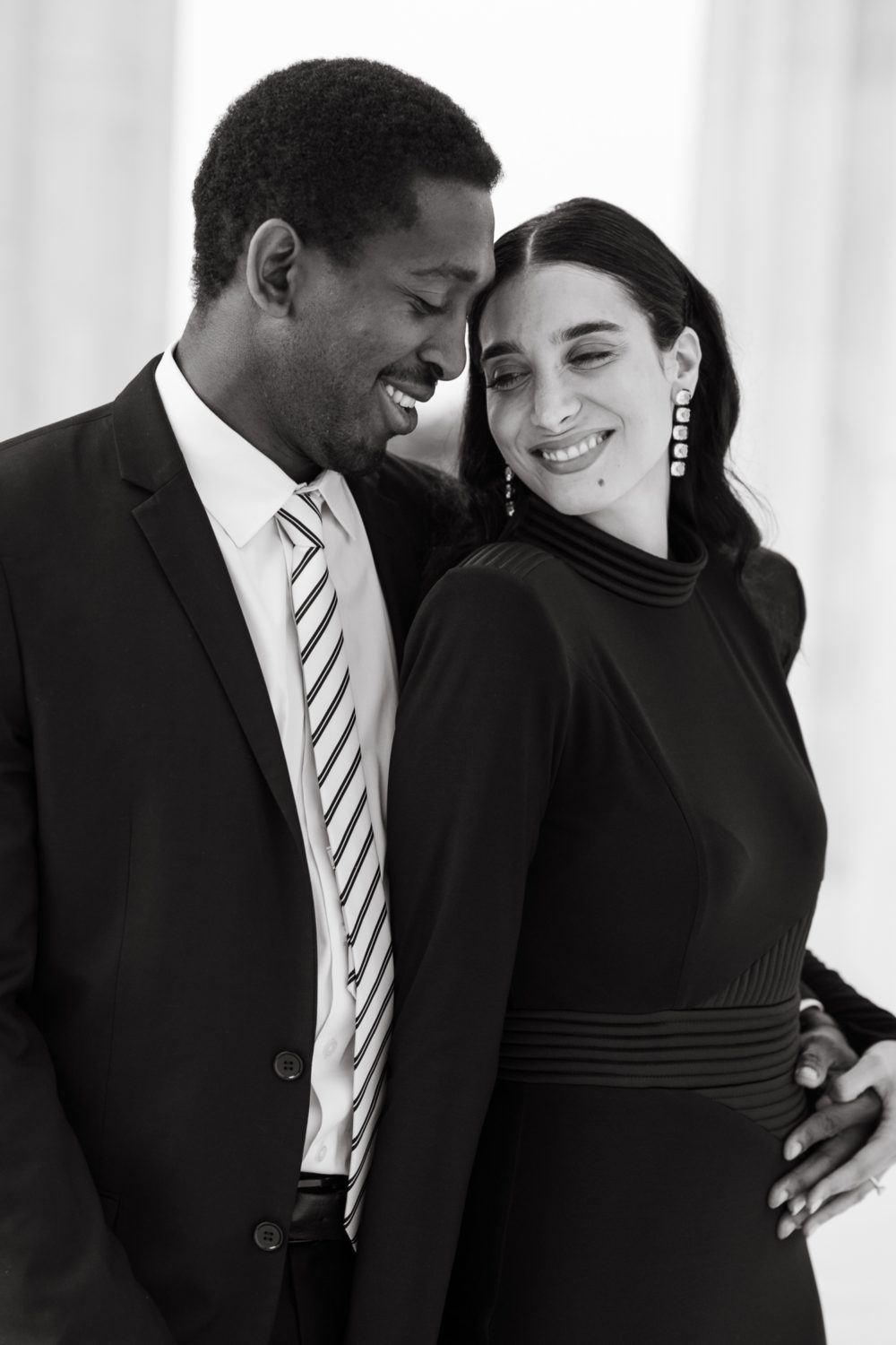 couple hugging smiling black and white