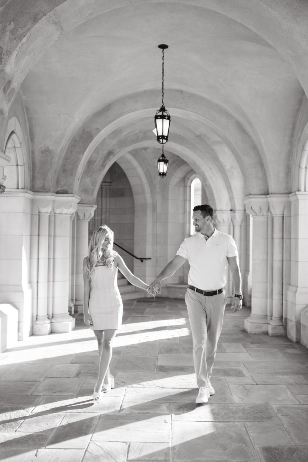 black and white washington national cathedral engagement couple walking