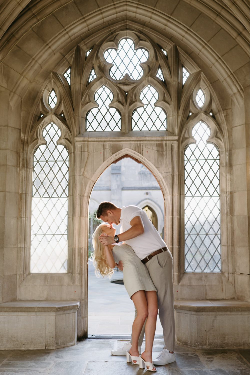 washington national cathedral engagement couple dancing in door frame golden hour