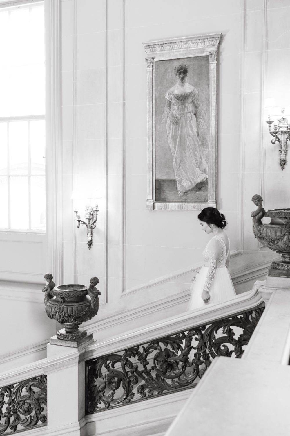 black and white bride walking down steps