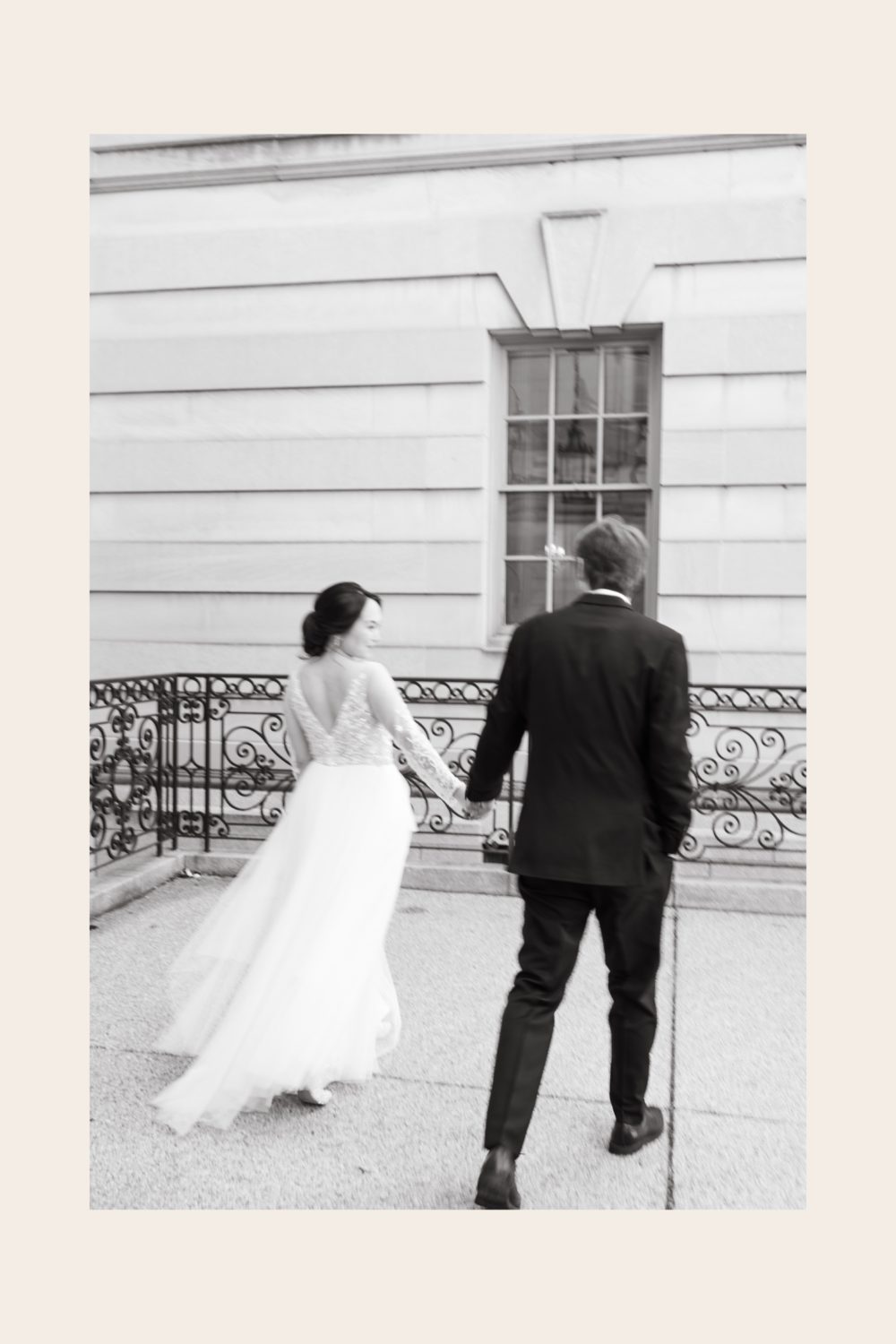 intimate wedding larz anderson house bride and groom holding hands black and white film