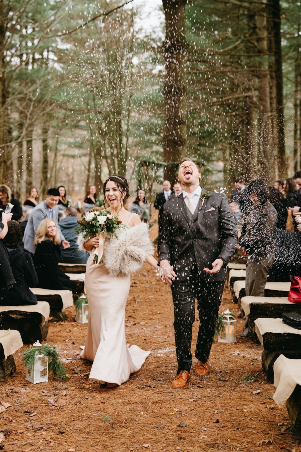 bride and groom ceremony exit snowing