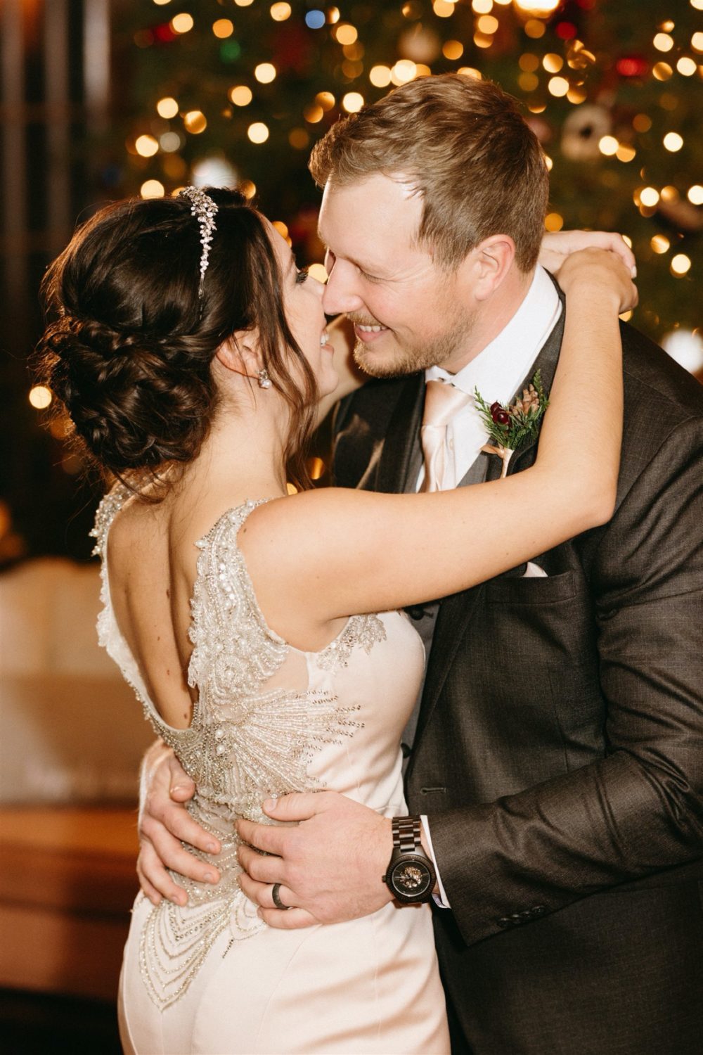 bride and groom dancing background twinkling lights