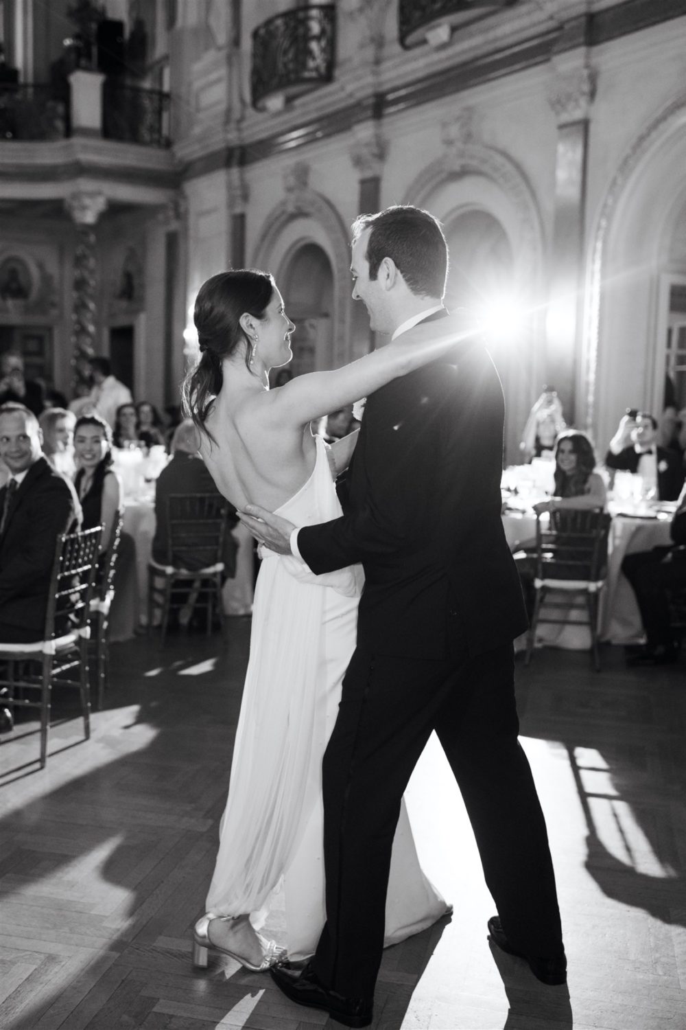 black and white bride and groom dancing smiling