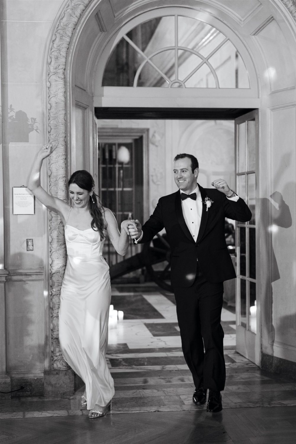 larz anderson house wedding black and white bride and groom holding hands