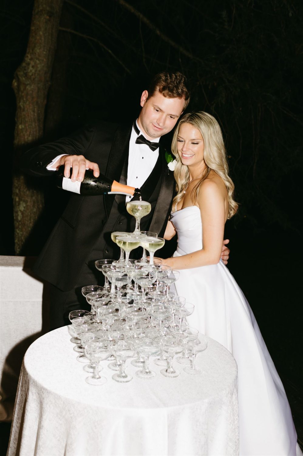 hannah baldwin photography couple pouring champagne new year business checklist