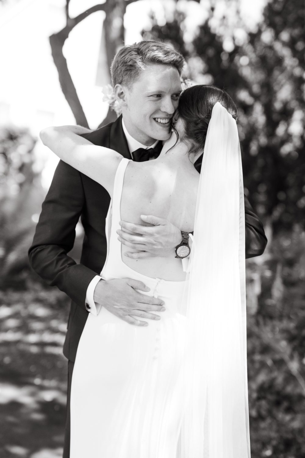 black and white woodstock inn wedding bride and groom hugging