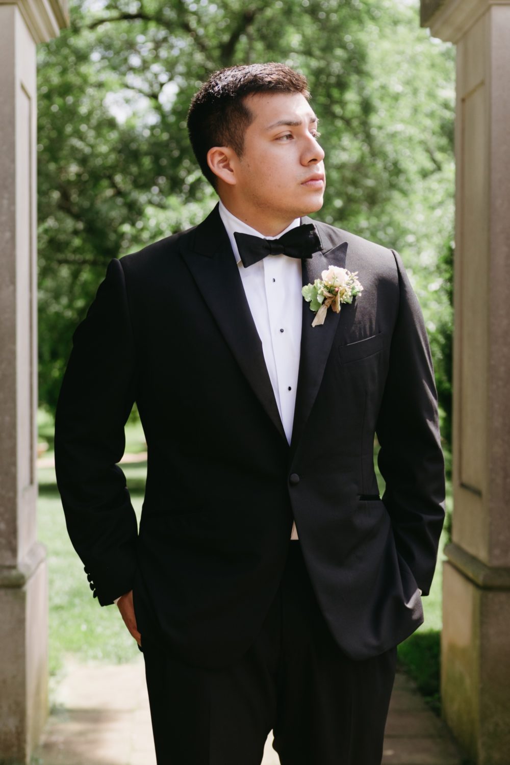 groom portrait black bowtie suit