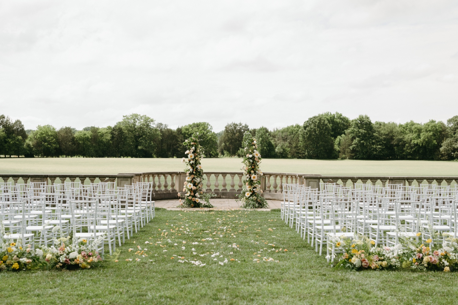 soiree great marsh estate wedding ceremony details chairs arch florals