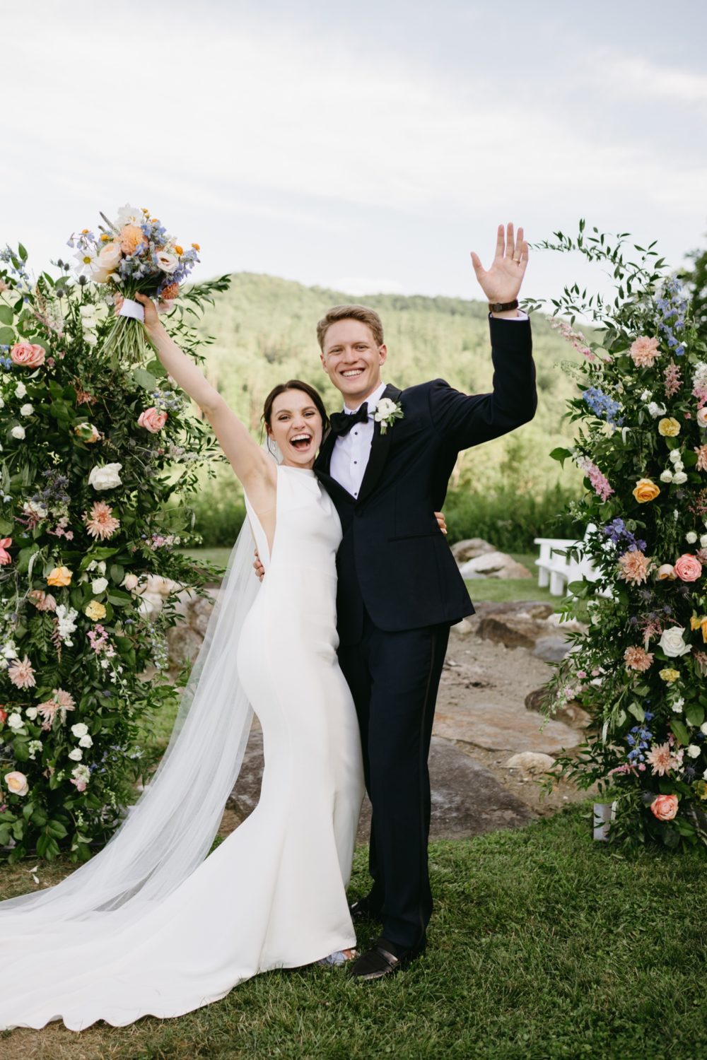 woodstock inn wedding bride and groom waving smiling