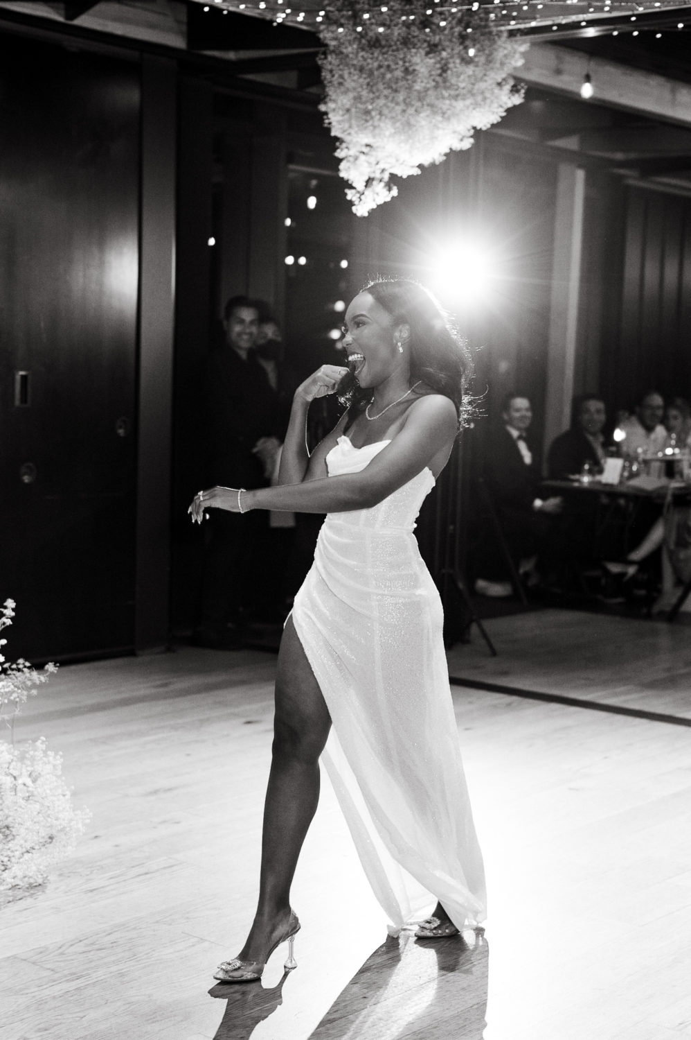 bride dancing black and white party wedding dress wooden dance floor