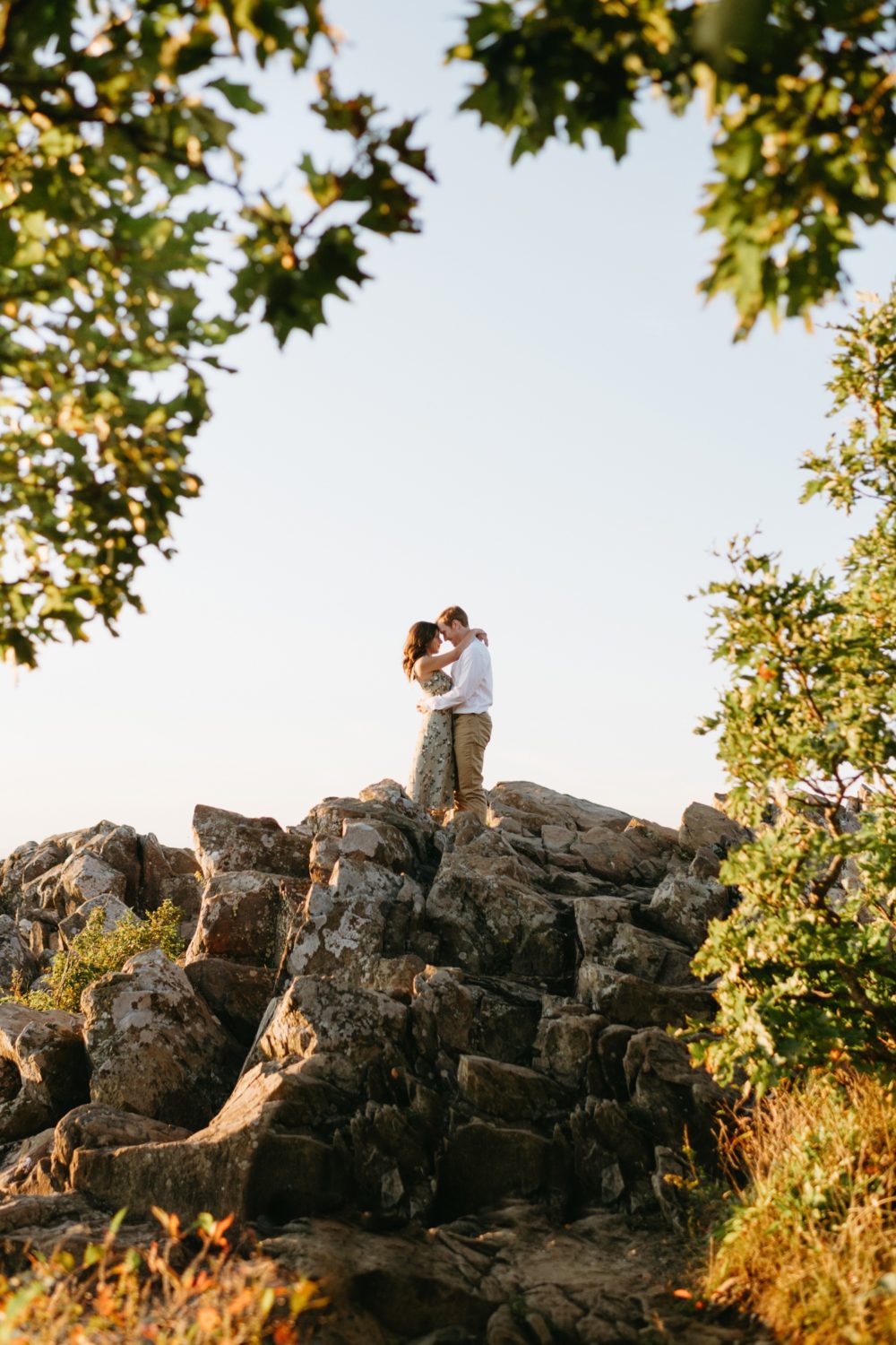 engaged couple hugging shenandoah valley overlook greenery