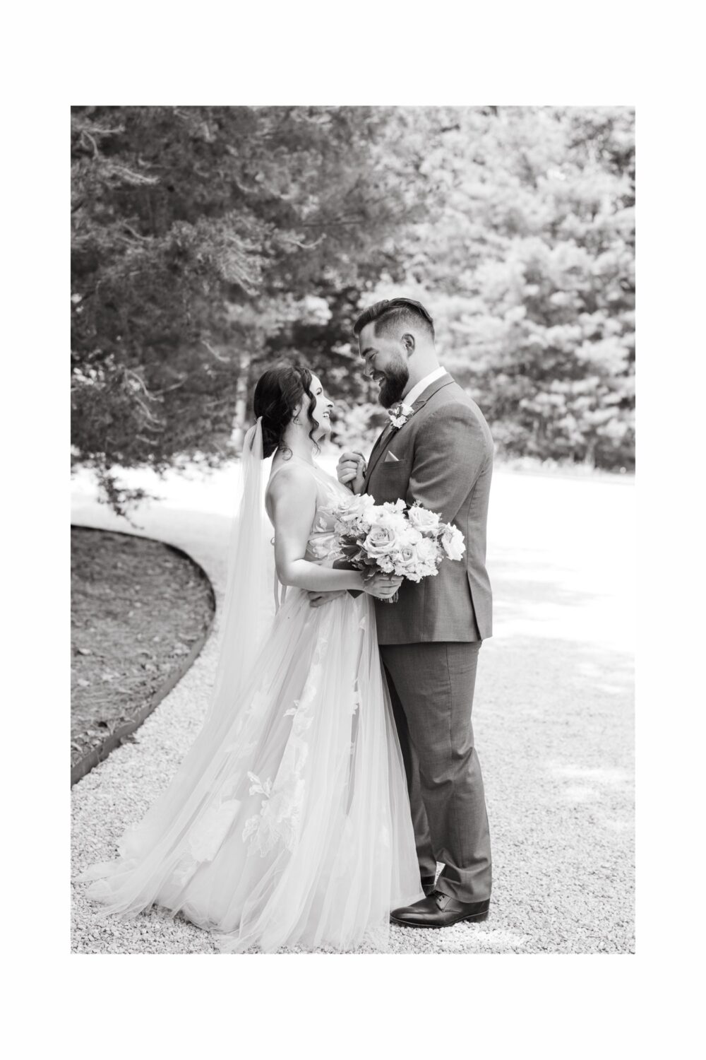 ivy rose barn bride and groom hugging holding hands wedding florals