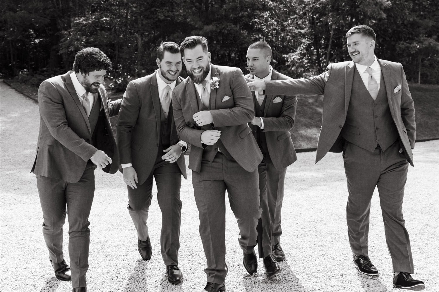 ivy rose barn groom and groomsmen smiling laughing black and white