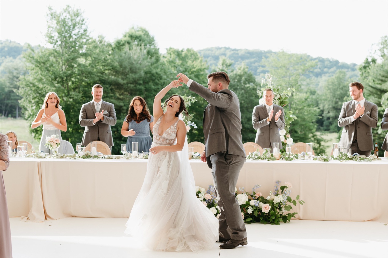 ivy rose barn bride and groom dancing smiling wedding party happy