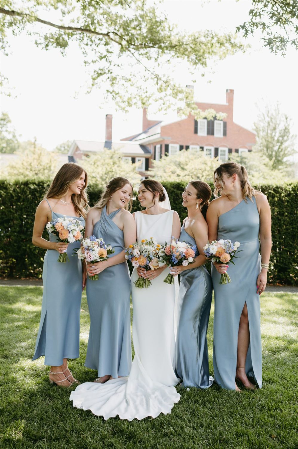 blue satin bridesmaid styles wildflower bouquets