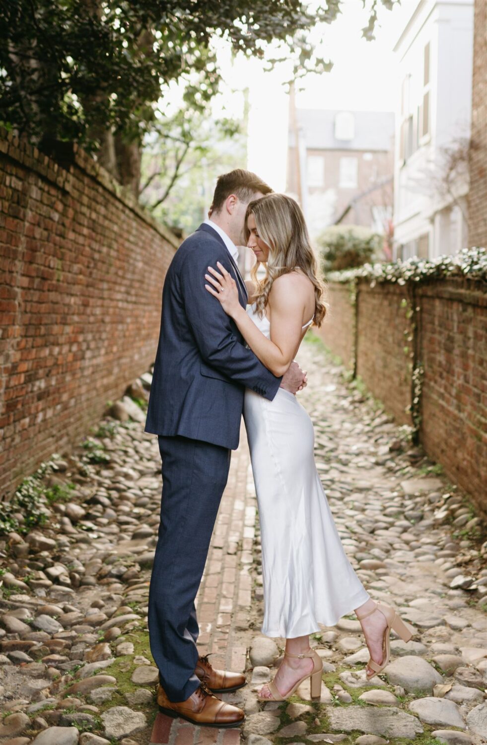 bride and groom hugging old town alexandria engagement session location