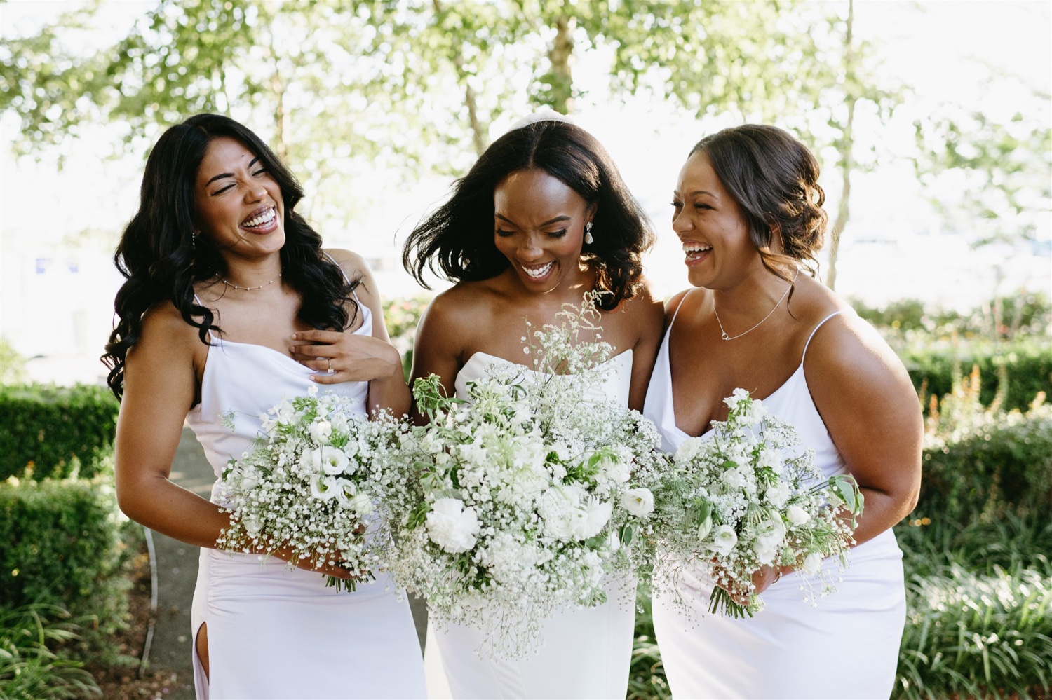 sisters of the bride and bride white bridesmaids gown