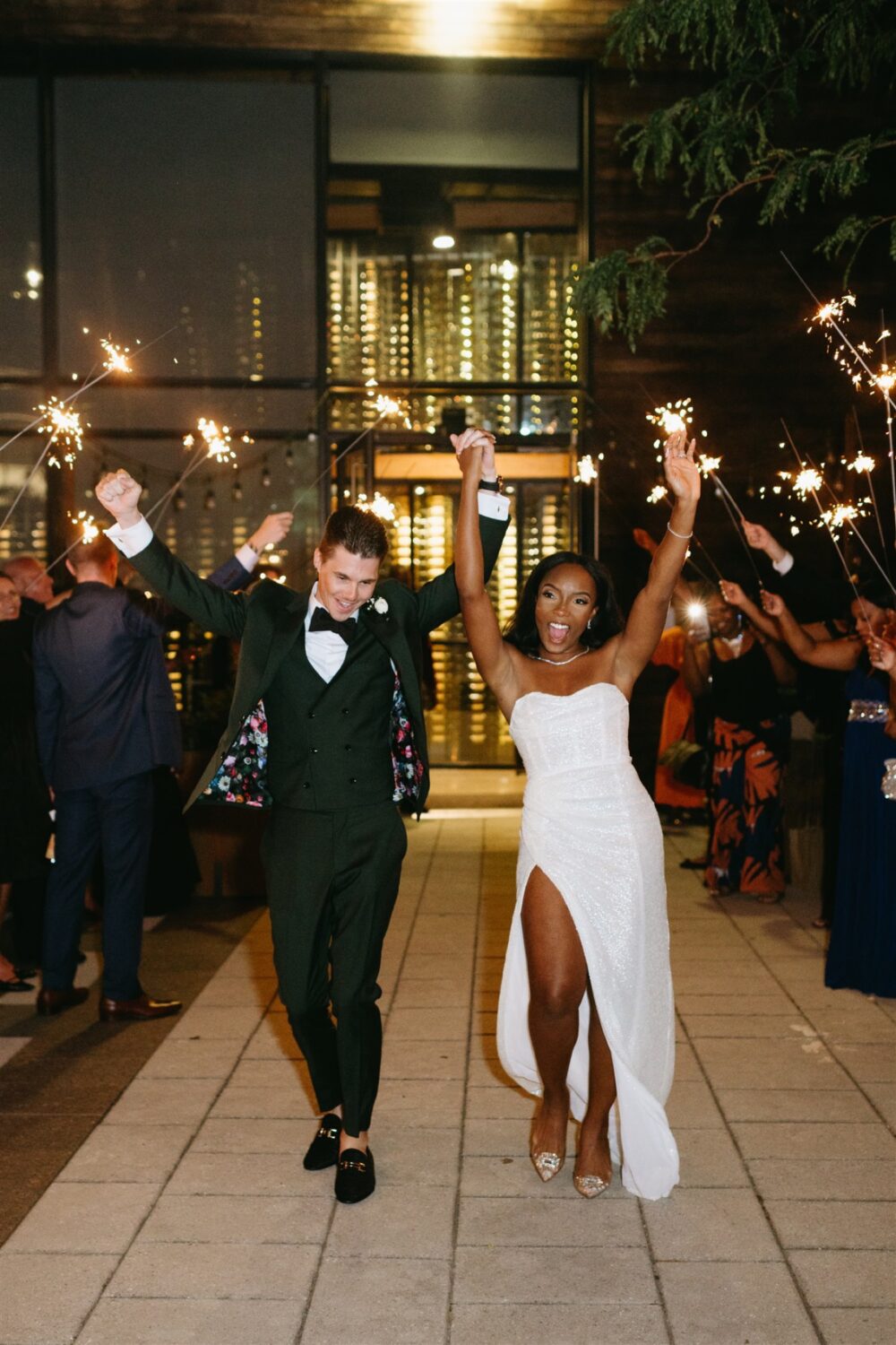 bride and groom celebrating firework wedding exit 