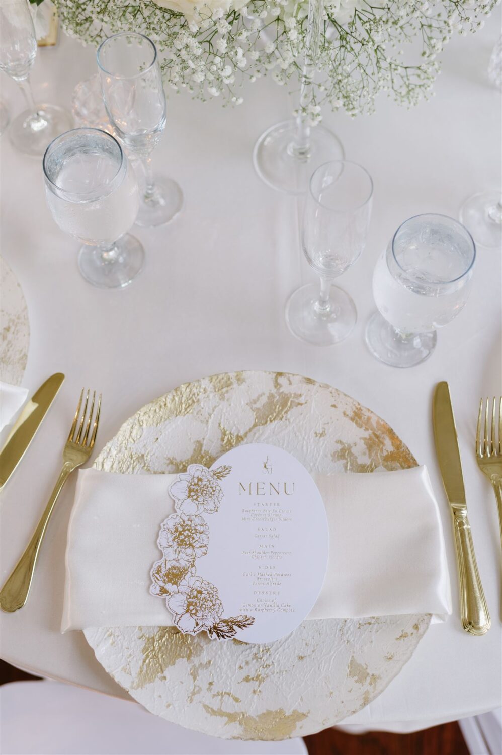 All White elegant wedding reception tablescape gold accent place setting