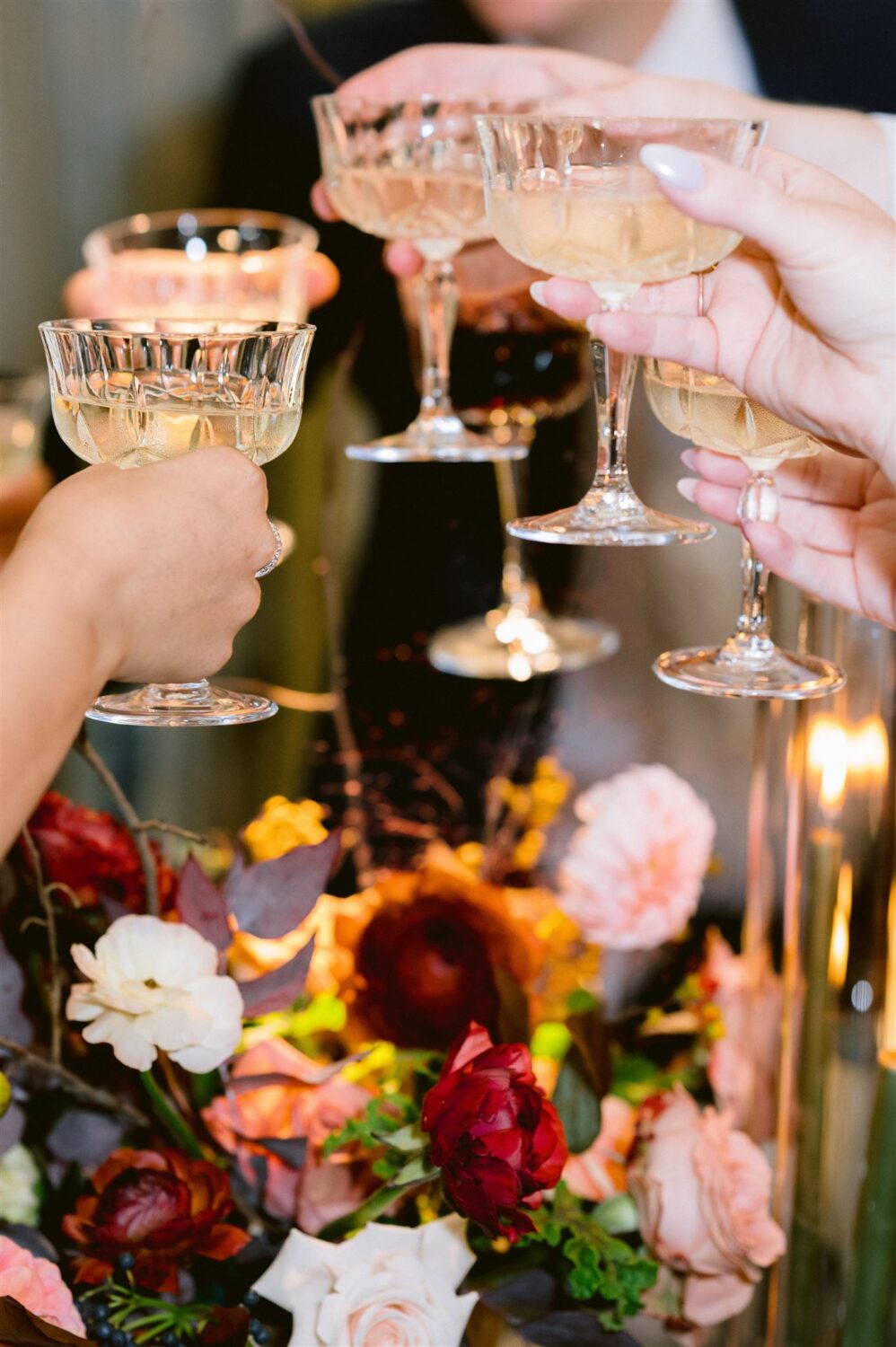 guests toasting with vintage champagne flutes
